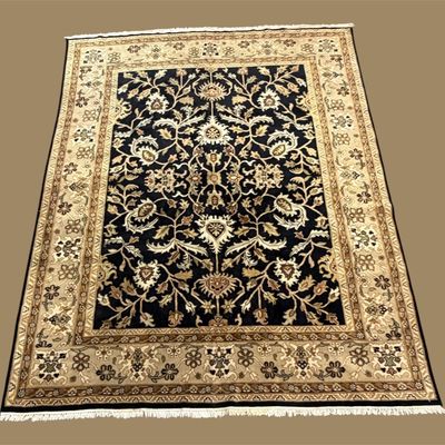 Black and ivory traditional area rug with elegant floral pattern