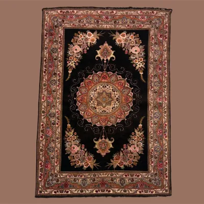 Black traditional area rug with ornate floral medallion and burgundy border