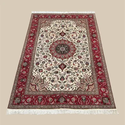 Red and ivory traditional area rug with central medallion