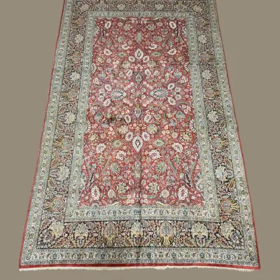 Soft red and ivory traditional patterned rug