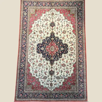 Ivory and burgundy traditional area rug with ornate central medallion
