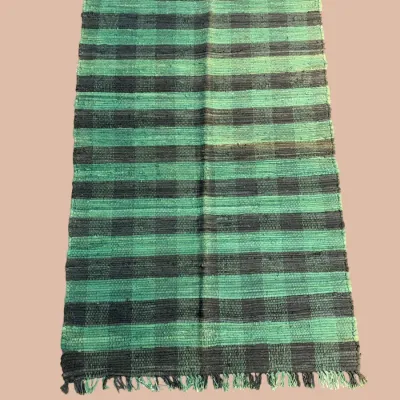Green and black striped flatweave rug with bold contemporary pattern