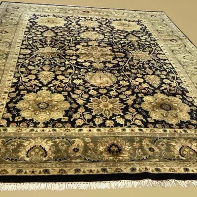 Black and gold traditional area rug with elaborate floral design