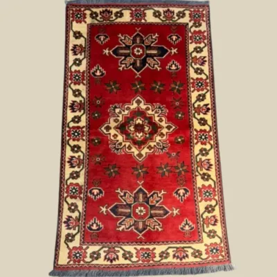 Vibrant red traditional rug with bold geometric medallion motifs
