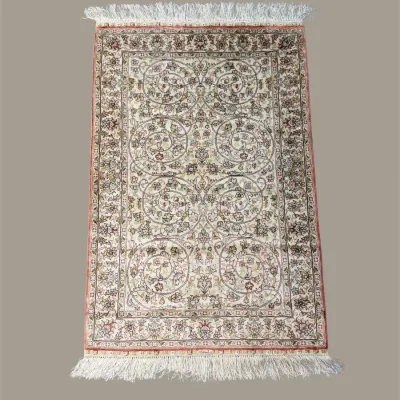 Traditional runner rug with intricate floral pattern in warm neutral and burgundy tones