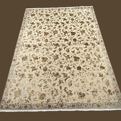 Ivory area rug with delicate black botanical and floral pattern