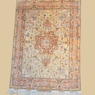 Ivory and blush traditional rug with delicate floral medallion and fringe