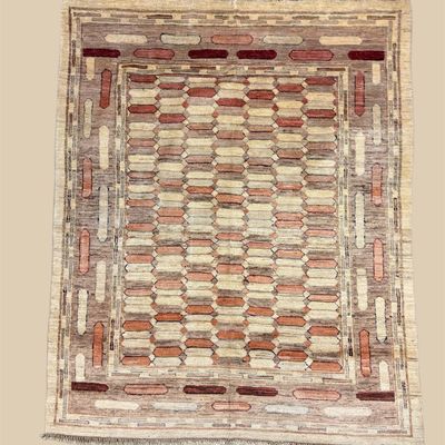 Neutral geometric area rug with repeating rectangular pattern and decorative border