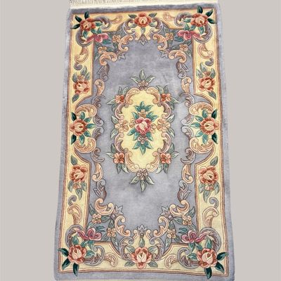 Elegant gray traditional rug with ornate floral border and central medallion