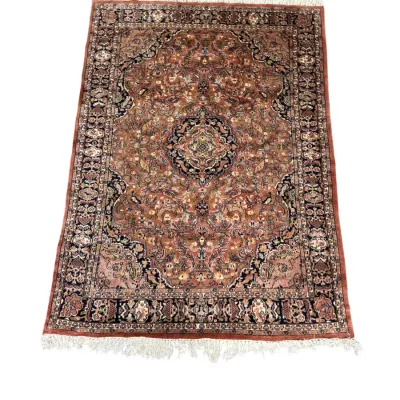 Ornate traditional rug in warm rust and neutral tones