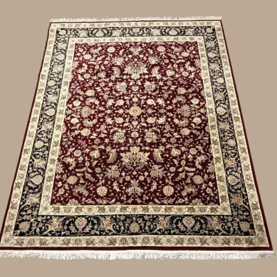 Dark red traditional rug with intricate all-over pattern