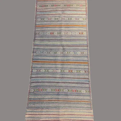 Multicolor striped flatweave rug with soft pastel tones