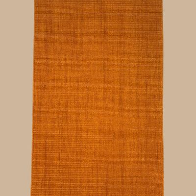 Solid rust-orange area rug with subtle tonal texture