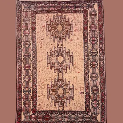 Vintage-style geometric rug in muted brown, rust, and neutral tones