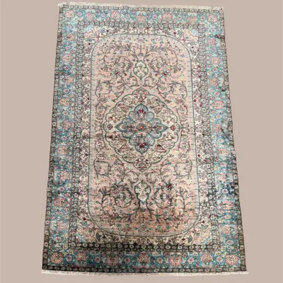 Ornate traditional rug with detailed central medallion