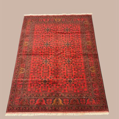 Rich red traditional area rug with intricate all-over pattern and dark border