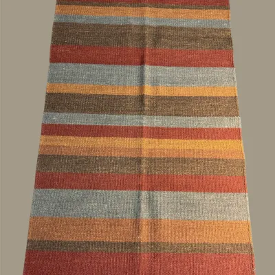 Contemporary striped rug in orange, gray, brown, and neutral tones