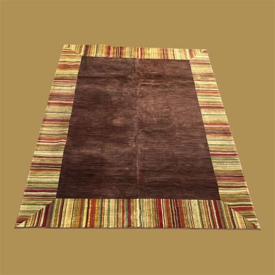 Contemporary dark brown area rug with colorful striped border