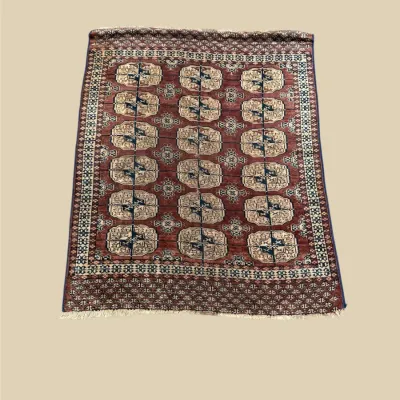 Classic repeating-pattern rug in burgundy and cream