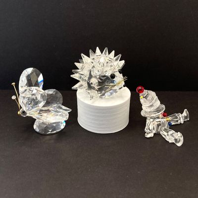 LOT 108: Collection of Swarovski Crystal Small Figurines - Butterfly, Porcupine and Clown