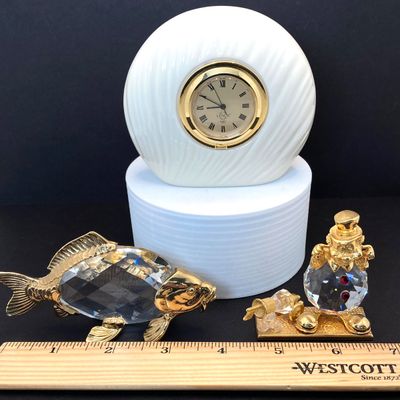 LOT 109: Lenox Desk / Table Clock, Crystal / Gold Tone Fish and Trimlite Strass Clown with Cannon Figurines