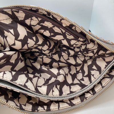 LOT 117: Silver Woven Faux Leather Clutch / Crossbody Bag with Wrist Strap