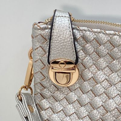 LOT 117: Silver Woven Faux Leather Clutch / Crossbody Bag with Wrist Strap