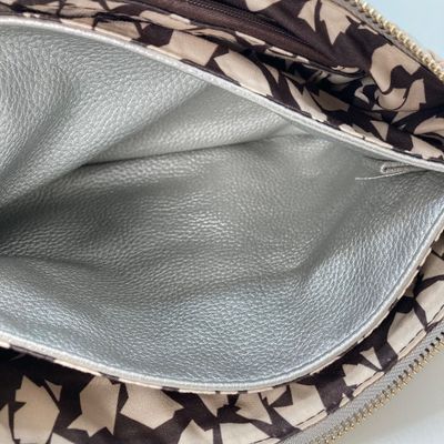 LOT 117: Silver Woven Faux Leather Clutch / Crossbody Bag with Wrist Strap