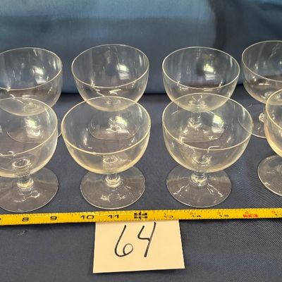 vintage clear glass champagne coupes and tall sherbet glasses
