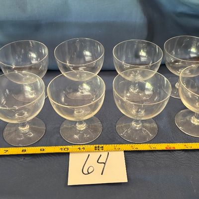 vintage clear glass champagne coupes and tall sherbet glasses