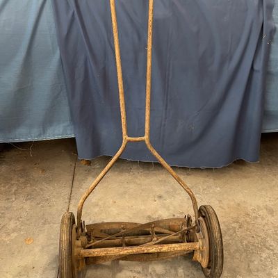 vintage cast-iron Zephyr manual push reel lawn mower