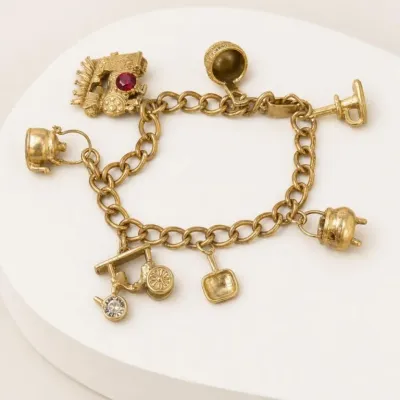 Sale Photo Thumbnail #113: Gold-Tone Charm Bracelet with Assorted Charms