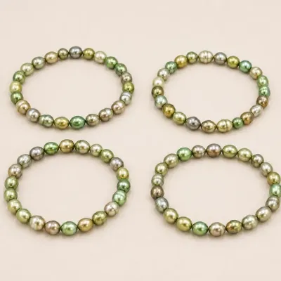 Sale Photo Thumbnail #68: Set of Four Green and Gold Beaded Bracelets