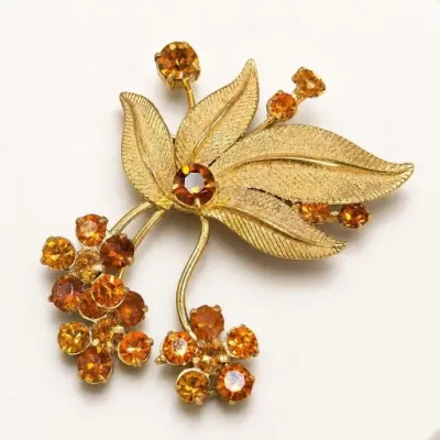 Sale Photo Thumbnail #79: Gold-Tone Floral Brooch with Orange Stones