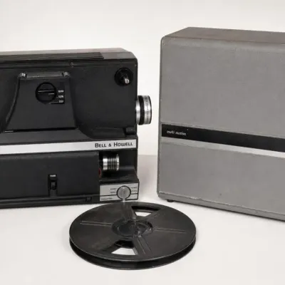 Sale Photo Thumbnail #226: Bell & Howell Movie Projector With Reel and Case