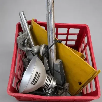 Red Basket With Metal Clamp Lamps and Yellow Panels
