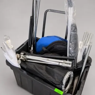 Black Tote With Assorted Metal Tripod Stands and Accessories