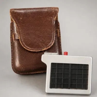 Metal Device With Brown Leather Case