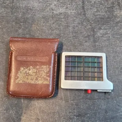 Brown Leather Case and Metal Device