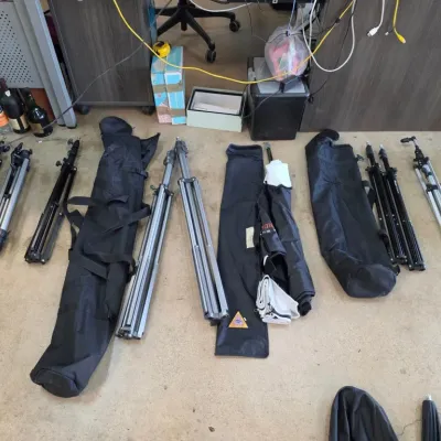 Assorted Camera Tripods and Carrying Bags
