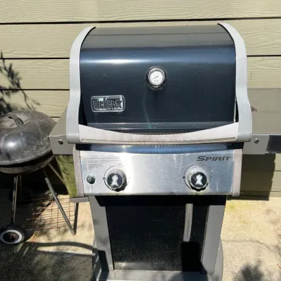 Weber Spirit Grill With Propane Tank And Small Charcoal Grill