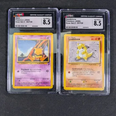(2) 2000 Pokemon Base Set - Sandshrew & Abra - CGC Graded