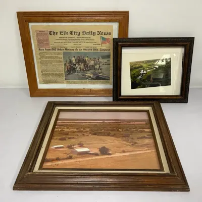 Framed Photos and News Article