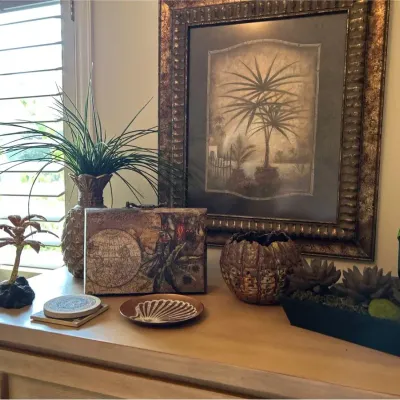 Various Pieces Of Decor Including Print "Tropical Moon Island Hideaway"