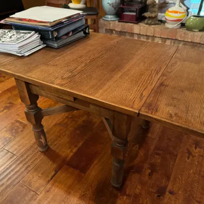 oak coffee table with sides that insert to make smaller