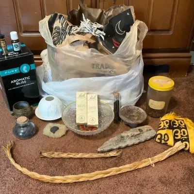 Witchy Protection Supplies Including An Oil Diffuser, Oil, Carnelian Stones, Glass Bowl, And More