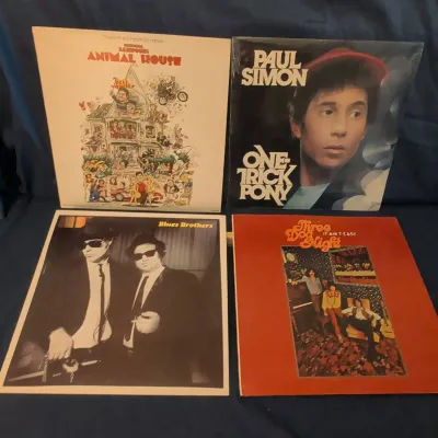4 Vinyl LPs - Sealed Paul Simon, Blues Brothers, Animal House & Three Dog Night