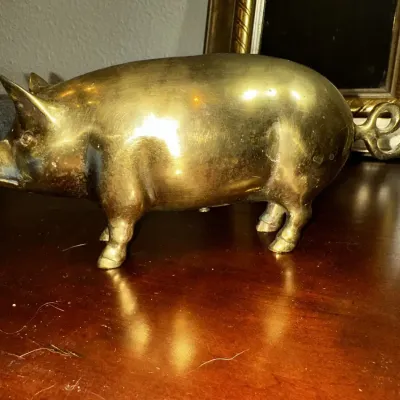 Polished Brass Piggy Bank and Gold-Tone Framed Wall Mirror
