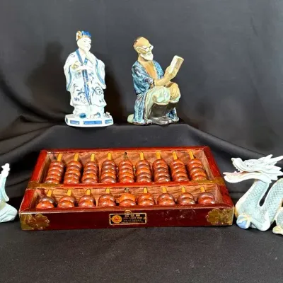 Abacus And Asian Figurines