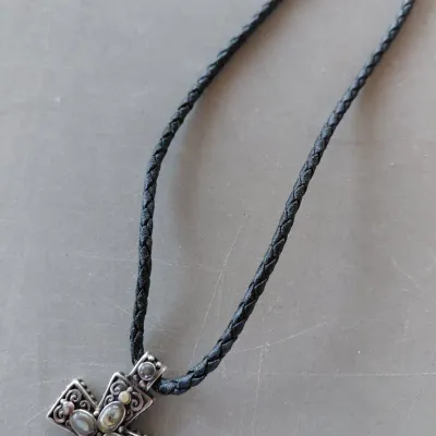 Sale Photo Thumbnail #219: Sterling Silver Cross with Abalone/Mother of Pearl on Black Braided chain.